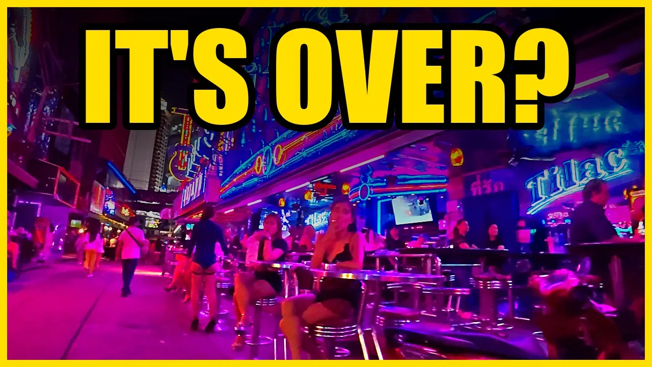 A neon-lit bar street in Pattaya at night, with the words It's over?